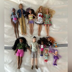 Lot of 11 Barbie dolls
